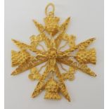 A bright yellow metal filigree Maltese cross, with Maltese stamps for 18ct, with a stylised