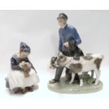 Two Royal Copenhagen figures including Amager Girl Knitting and farm lad with two calfs Condition