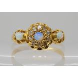 An 18ct gold opal and diamond chip ring, hallmarked Chester 1918, finger size Q, weight 3gms