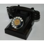 A black vintage telephone Condition Report: Available upon request