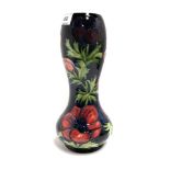 A Moorcroft gourd shaped anemone pattern vase, 28cm high Condition Report: Good condition, no