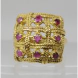 An 18ct gold red gem and diamond woven square ring, size M, weight 6.1gms Condition Report: