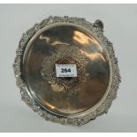 A silver card tray, Sheffield 1913, of circular form with central blank cartouche on three scrolling