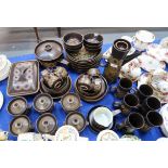 A Denby Arabeque dinner service comprising mugs, soup pots, saucepan, oven dish, plates, bowls,