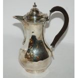 A silver chocolate pot, London 1919, of plain baluster shape, 21.5cm high, 516gms Condition