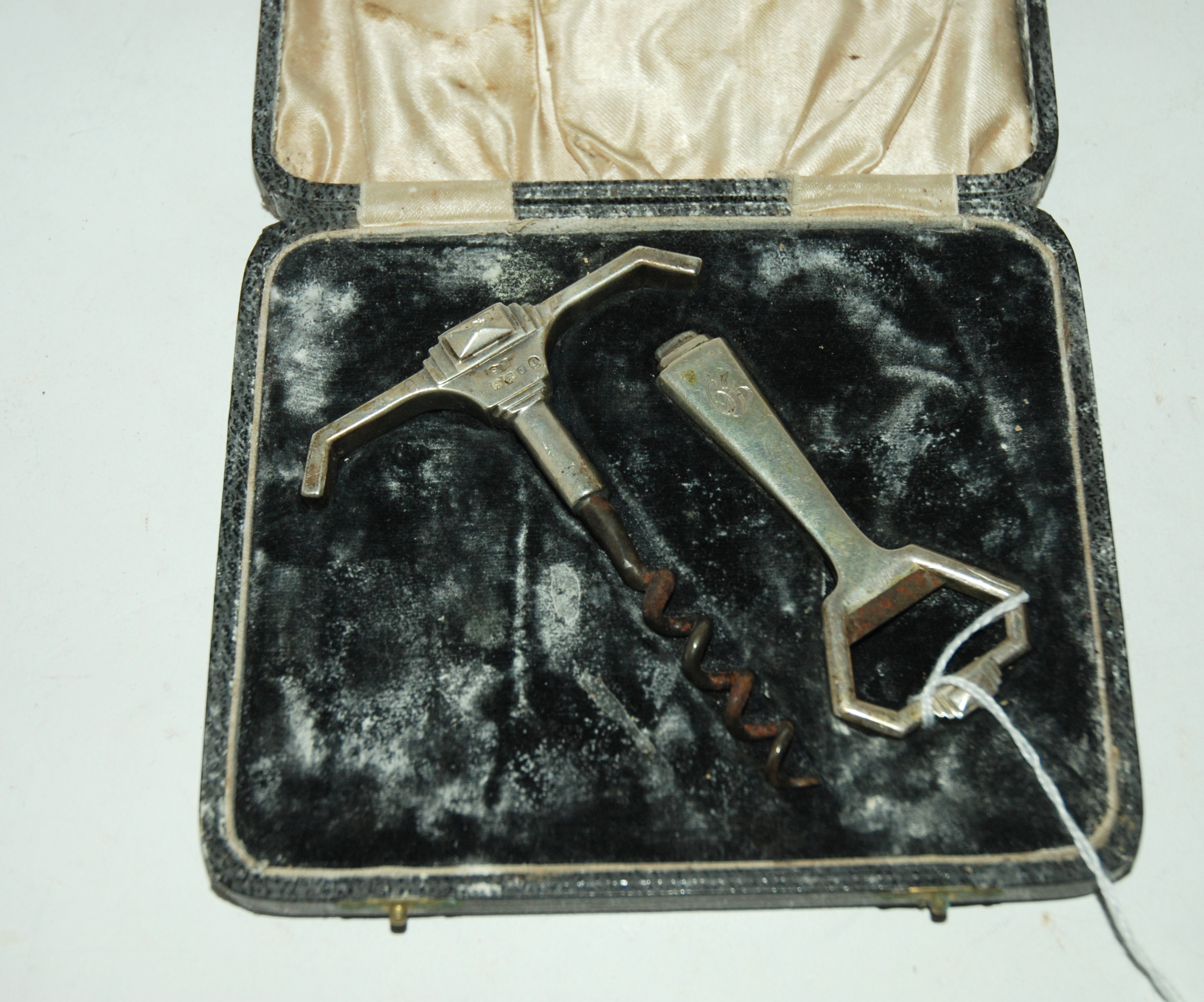 A cased Art Deco silver corkscrew and bottle opener set, Birmingham marks Condition Report:
