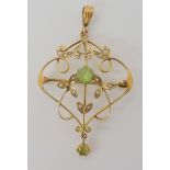 A 15ct peridot and pearl Edwardian pendant brooch, length 5.4cm, weight 3gms Condition Report: