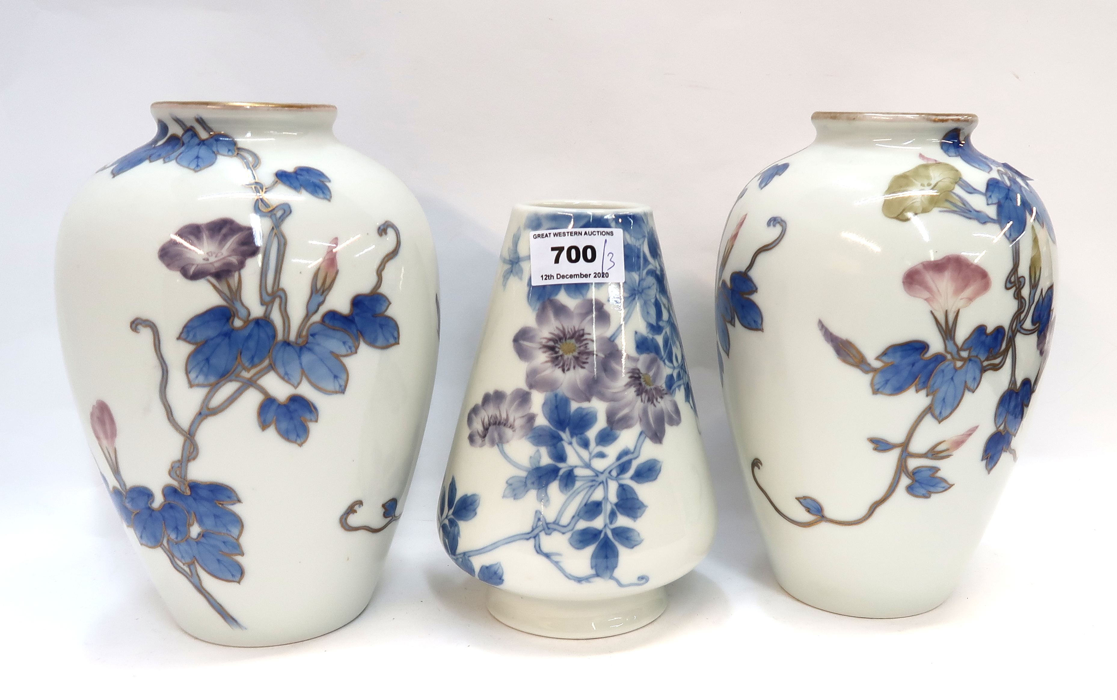 A pair of Japanese convulvulus decorated porcelain vases and another vase Condition Report: