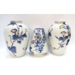 A pair of Japanese convulvulus decorated porcelain vases and another vase Condition Report: