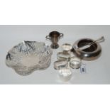 A lot comprising a silver dish with pierced decoration, three silver napkin rings, a small silver