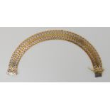 A 9ct three colour gold bracelet, length 21cm, weight 30.1gms Condition Report: Available upon