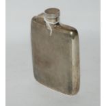A silver spirit flask, Birmingham 1937, rectangular with engine turned decoration, 12cm x 8cm,