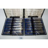 A lot comprising two cased twelve piece sets of silver handled dessert knives and forks, Sheffield