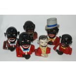Six various money banks, 20cm high and smaller Condition Report: Available upon request