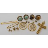 A yellow metal filigree cross 4.4cm x 2.3cm, two 9ct bar brooches one with gold nuggets and a