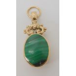 A 9ct gold double sided fob pendant set with malachite and banded agate, with large hallmarks for