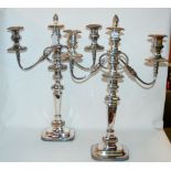 A pair of silver plated three-light candelabra, 55cm high Condition Report: Available upon request
