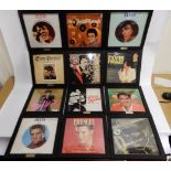 A box of Elvis Presley LP records with wall hanging frames including Elvis Rocks, Inspirations,