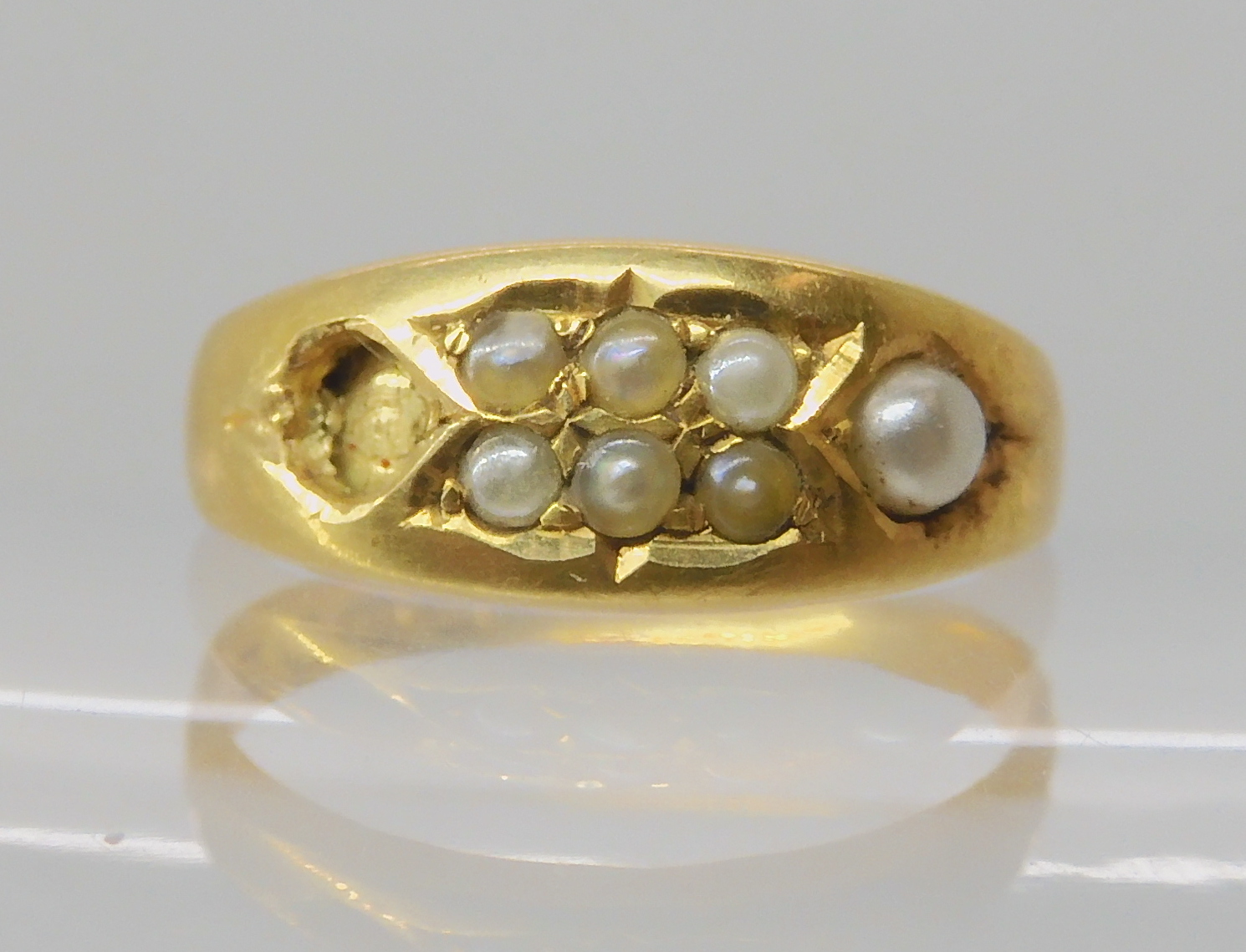 A Victorian 18ct gold pearl set ring, hallmarked Birmingham 1887, (one pearl missing) size P, weight