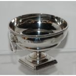 A silver bowl, Edinburgh 1926, with gadrooned rim and twin lion's mask handles on square gadrooned