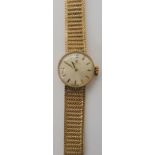 A 9ct gold ladies Omega watch diameter of the case 1.7cm, length of integral strap 16.5cm, weight