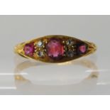 An 18ct gold red gem and diamond ring, hallmarked Birmingham 1908, size O, weight 2.6gms Condition