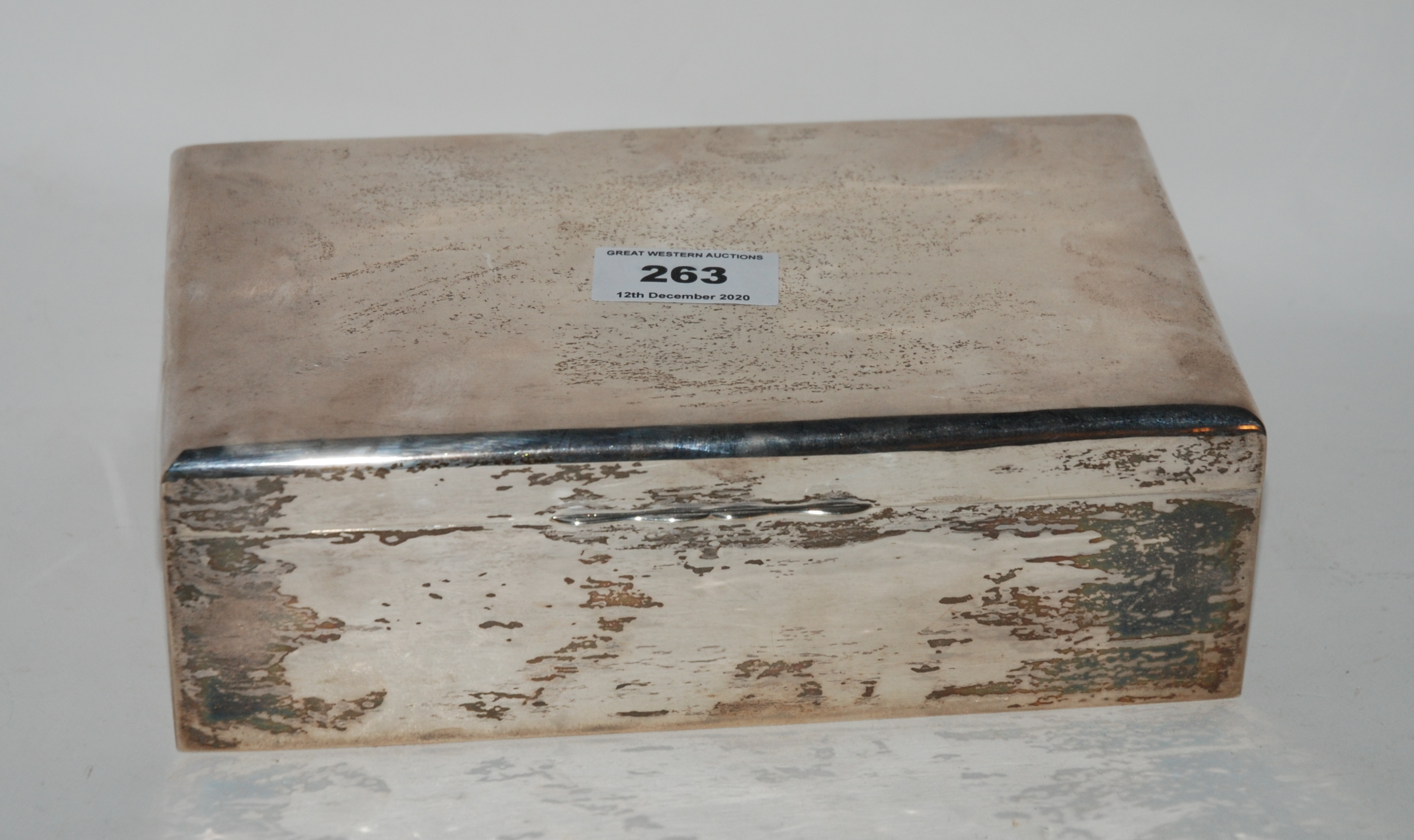 A silver cigarette box, rubbed Birminghm marks, 22cm x 13cm x 7cm Condition Report: Available upon