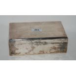 A silver cigarette box, rubbed Birminghm marks, 22cm x 13cm x 7cm Condition Report: Available upon