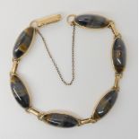 A 9ct gold mounted golden and blue tigers eye bracelet, length 20cm, weight 17.2gms Condition