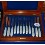 A cased twenty four piece EP and mother of pearl dessert cutlery set Condition Report: Available