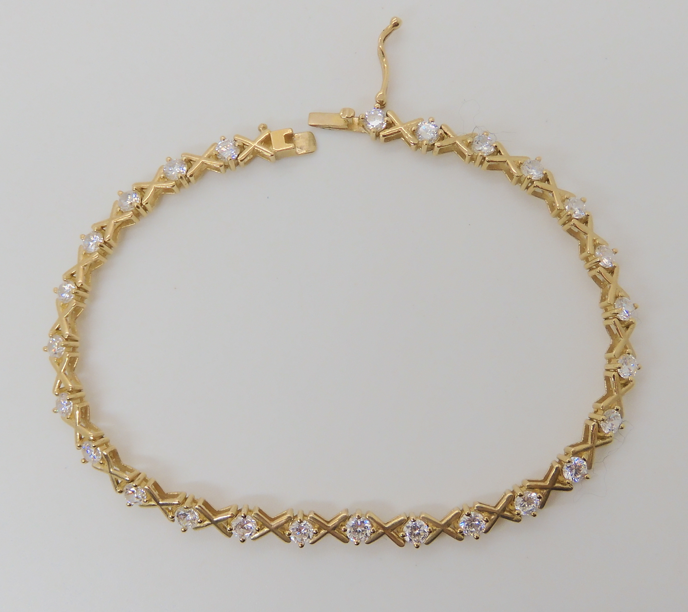 A 9ct gold cz set bracelet, length 18.3cm, weight 6.7gms Condition Report: Available upon request