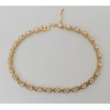 A 9ct gold cz set bracelet, length 18.3cm, weight 6.7gms Condition Report: Available upon request