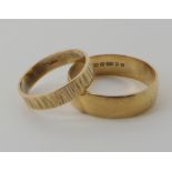 A 9ct gold gents wedding ring size 3, together with a ladies 9ct wedding ring size S, weight