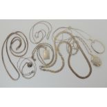 Silver chains, a decorative locket etc Condition Report: Not available for this lot