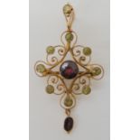 A 9ct gold garnet and peridot Edwardian pendant brooch dimensions 5.1cm x 2.5cm, weight 3gms