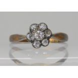 An 18ct gold diamond flower ring, set with estimated approx 0.22ct of old cut diamonds, size O1/2,