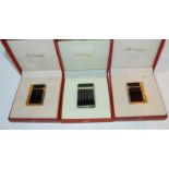 Three cased Dupont cigarette lighters Condition Report: Available upon request