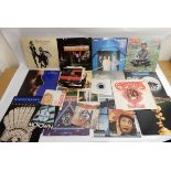 A box of vinyl records with The Police, UB40, Fleetwood Mac, Elton John, Phil Collins, Rose Rouge