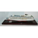 A cased model of The World cruise liner in perspex case, 61cm long overall Condition Report: