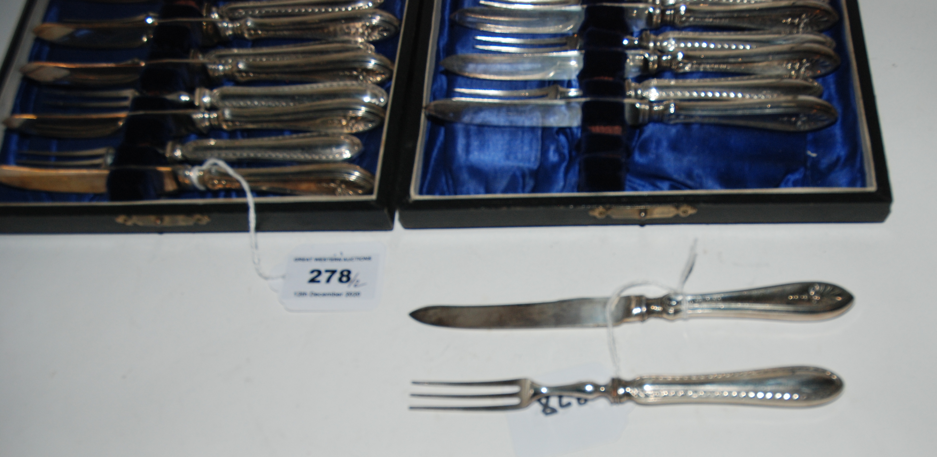 A lot comprising two cased twelve piece sets of silver handled dessert knives and forks, Sheffield - Image 2 of 2