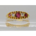 An 18ct gold red gem and diamond ring, hallmarked Birmingham 1918, size M, weight 3.7gms Condition