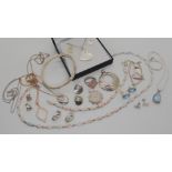 A boxed Ortak pendant and earring set, a silver mounted synthetic opal necklace and bracelet set,