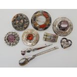 A collection of silver and white metal Scottish themed brooches to include agate set and two