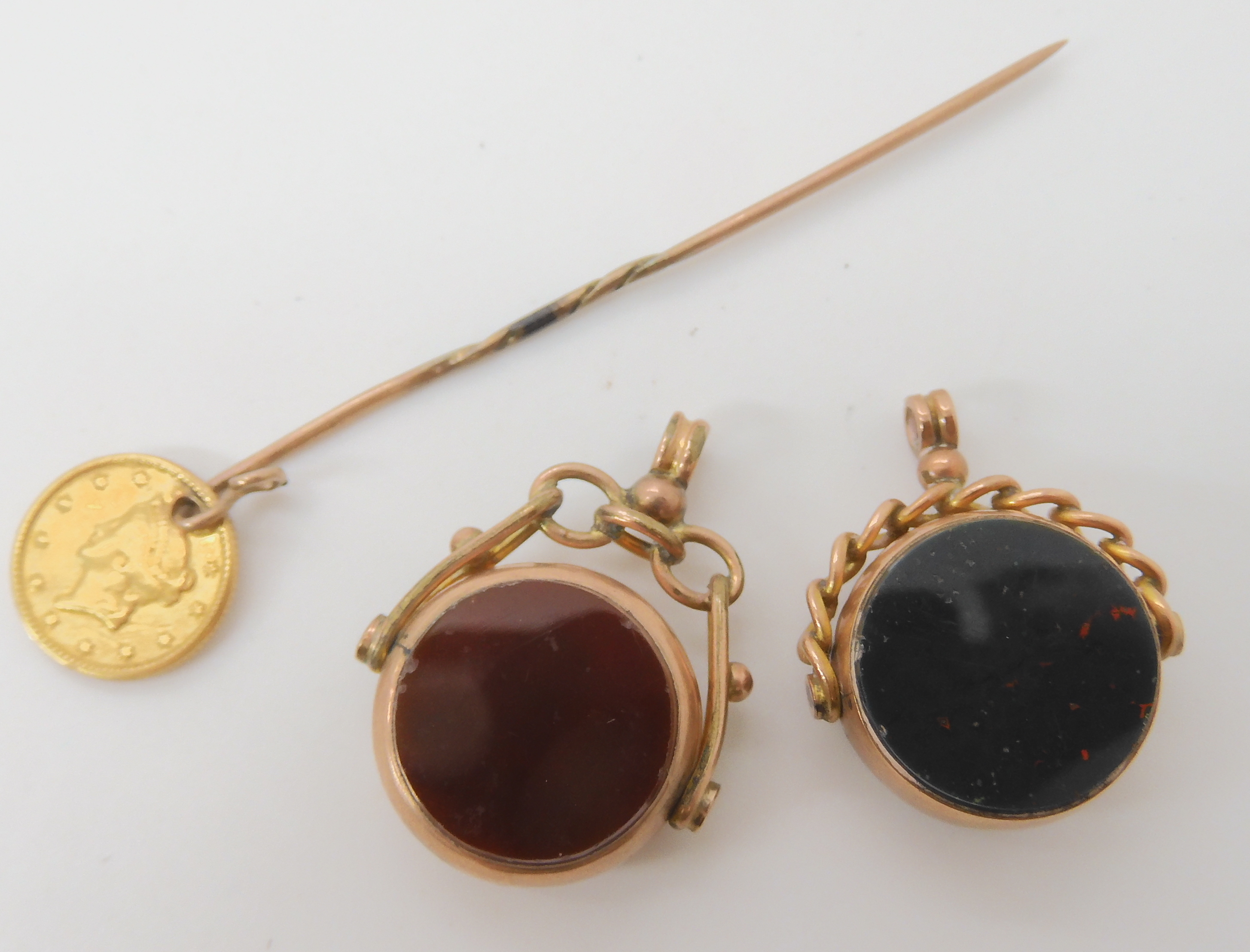 Two 9ct gold double sided agate fob seals, and a stick pin with an attached 1853 1 dollar USA - Image 2 of 3