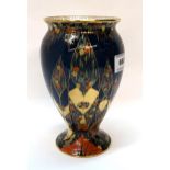 A Carlton Ware Fantasia pattern vase on dark blue ground, 17.5cm high Condition Report: Available