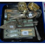 A lot comprising a tray lot of EP - salts, spirit flask, cutlery and a tray of loose cutlery
