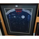 A Scotland replica short-sleeved shirt, the front bearing numerous player autographs, framed and