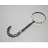 A Burmese white metal parasol handle mounted on a magnifying glass Condition Report: Available
