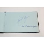 An autograph album containing numerous autographs including Sandy Lyle, Russ Abbot, Bruce Forsyth,