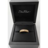 A 9ct gold knot work ring by Sheila fleet in original box, finger size P1/2, weight 4.3gms Condition